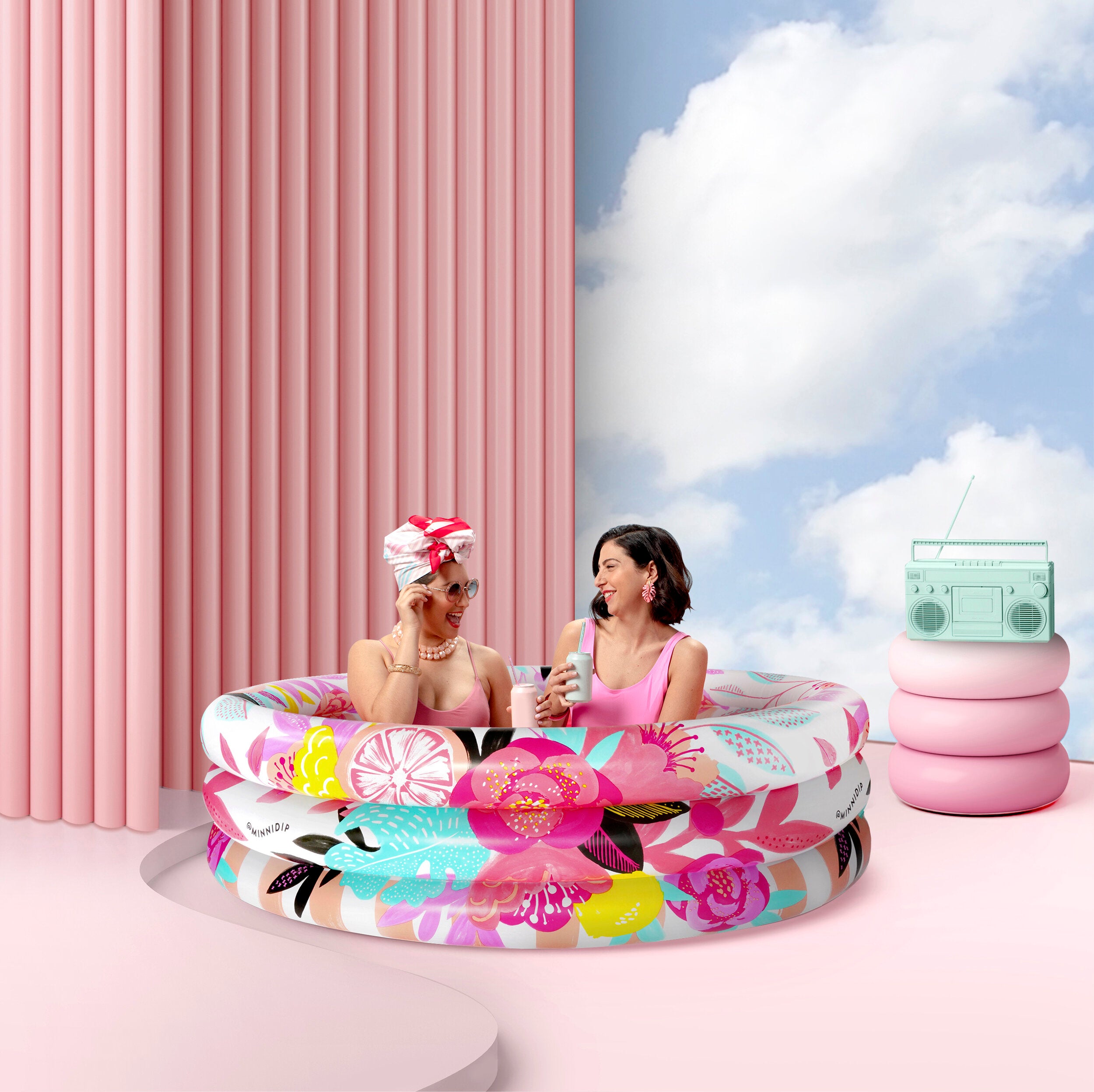 the STOP AND SMELL THE ROSÉ luxe inflatable pool