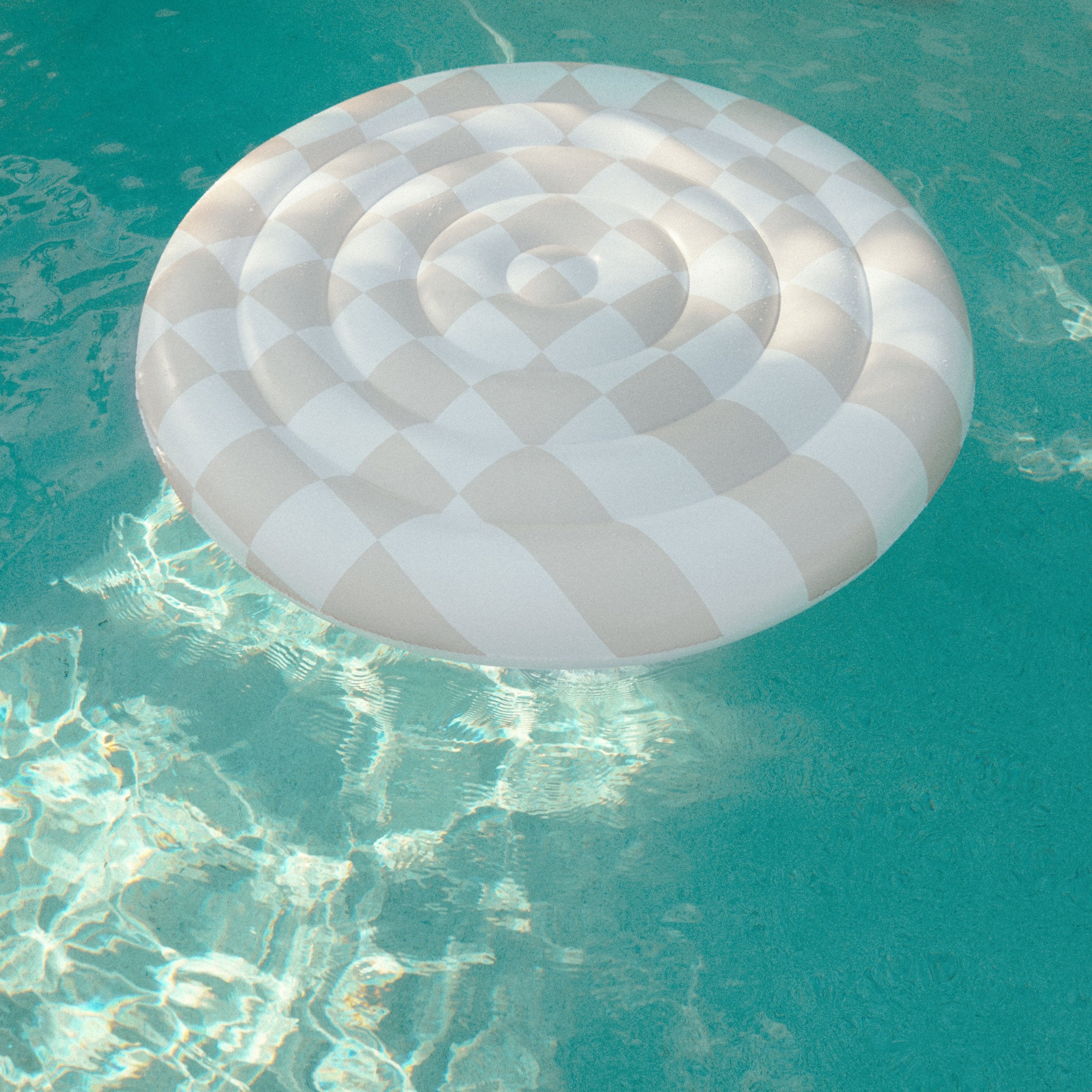 the CHECKER CABANA STRIPE Luxe Inflatable Round Float