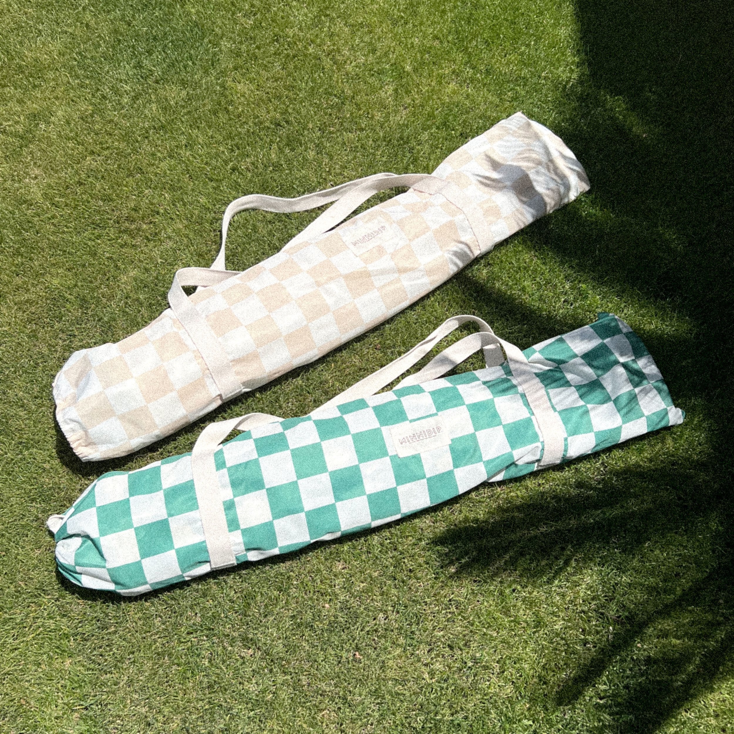 the CHECKER CABANA STRIPE Beach Umbrella in Sand